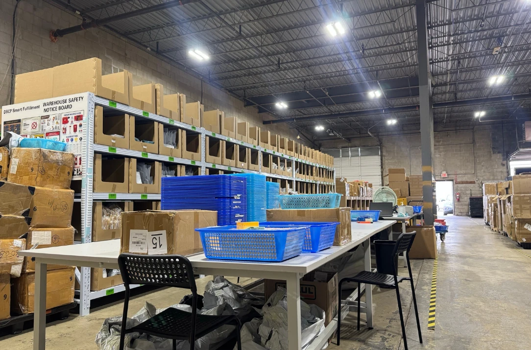 Packing benches and racked inventory inside the DSCP Smart Fulfillment East Coast 3PL warehouse in New Brunswick, New Jersey